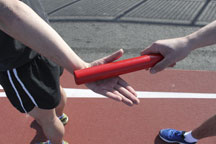 Baton is Angled So it Makes Contact Between the Thumb and Index Finger